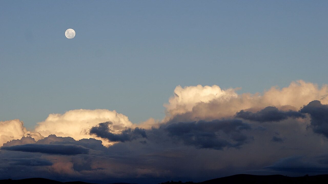 Full moon over clouds for the Moon Palace and Chang'e symbolism