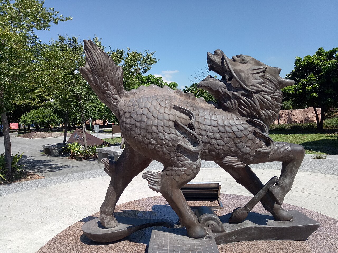 Chinese mythology qilin meaning opening image with a qilin statue in a park setting