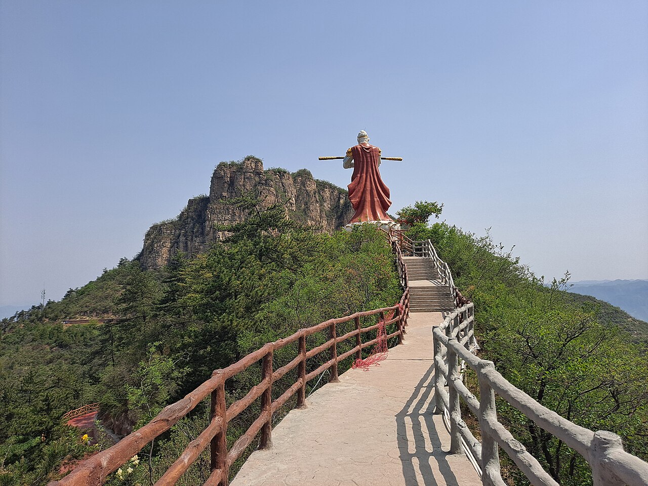Monkey King statue context for explaining character traits, powers, and retelling boundaries