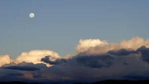 Moon above a bank of clouds